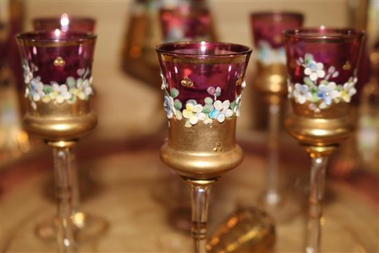 A Venetian ruby and gilt-painted liqueur set with a pair of matching vases and tray